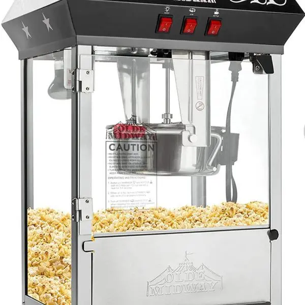 A black and silver popcorn machine filled with popcorn, featuring the brand name "Olde Midway," three red switches, and a clear viewing window – perfect for adding that nostalgic touch to any slime party.