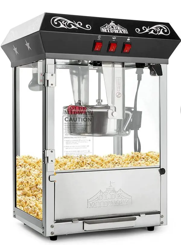 A black and silver popcorn machine filled with popcorn, featuring the brand name "Olde Midway," three red switches, and a clear viewing window – perfect for adding that nostalgic touch to any slime party.