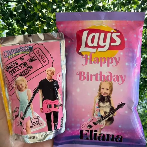 Customized Capri Sun and Lay's chip bag with a birthday theme, featuring a child holding a guitar. The text includes "Happy Birthday Eliana" and "Rocks to Eliana's 5th Birthday." Pair them with our Large Greenery Photo Backdrop with Neon Sign for the perfect slumber party setup that adds extra flair to your celebration!