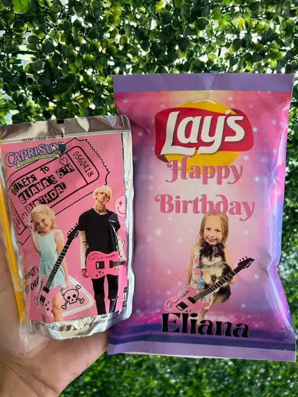 Customized Capri Sun and Lay's chip bag with a birthday theme, featuring a child holding a guitar. The text includes "Happy Birthday Eliana" and "Rocks to Eliana's 5th Birthday." Pair them with our Large Greenery Photo Backdrop with Neon Sign for the perfect slumber party setup that adds extra flair to your celebration!