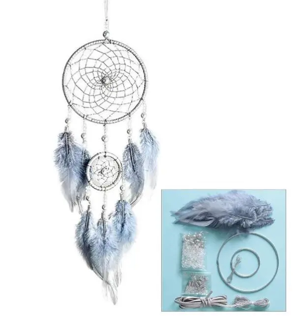 Immerse yourself in the artistry of our DIY Dream Catcher Add-On Kit, a must-have for craft enthusiasts and spirituality seekers alike. This exquisite set includes a stunning white and light blue dream catcher, meticulously designed with a large circular web interwoven with intricate blue beads and delicate feathers, destined to captivate your imagination. Hanging below is an elegant smaller web decorated with an array of vibrant feathers that add a splash of color and movement. Enhance your crafting experience with an included inset showcasing all essential materials: premium quality feathers, sparkling beads, durable threads, and sturdy metal rings—all elegantly presented against a soothing light blue backdrop. Perfect for adding a touch of tranquility and mystique to any room while honing your DIY skills.