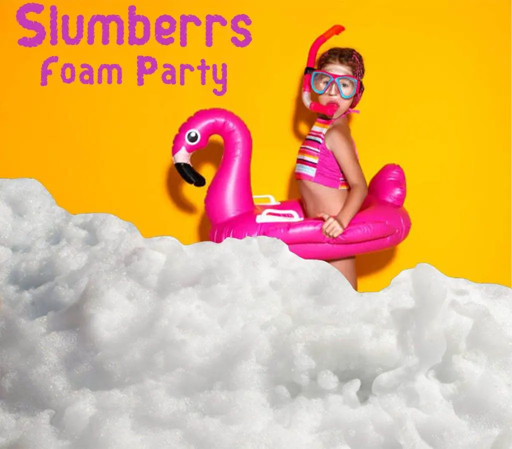 A person wearing a snorkel, mask, and swimwear stands in a foam party. They have a pink flamingo float and the background is yellow. Text reads "Slumberrs Foam Party—perfect for your next kids party rental!