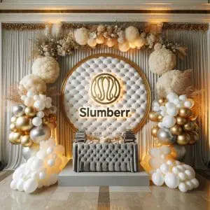 Elegant event setup with a large circular logo reading "Slumberr" surrounded by balloons and floral decorations in neutral tones, perfectly tailored for a Central Florida corporate event.