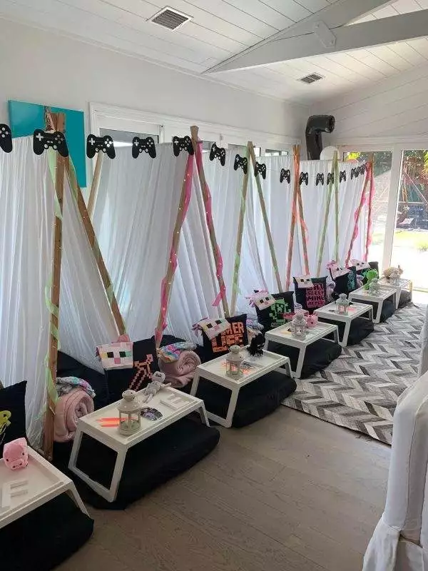 Host an unforgettable Minecraft-themed sleepover with individual tents, decorated tables, and gaming-themed accessories like Minecraft character pillows and pixelated designs. Perfect for a slime party or consider using a kids party rental service to make it hassle-free!