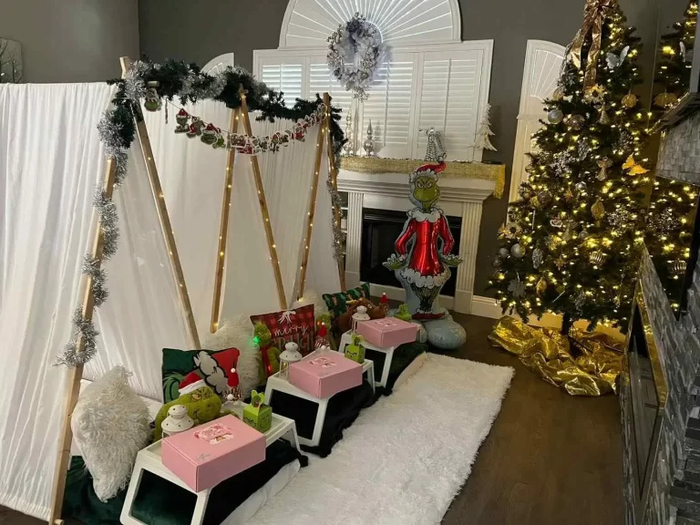 A cozy living room decorated for Christmas in Central Florida with a golden tree, fireplace adorned with garlands, and festive cushions on a sofa.