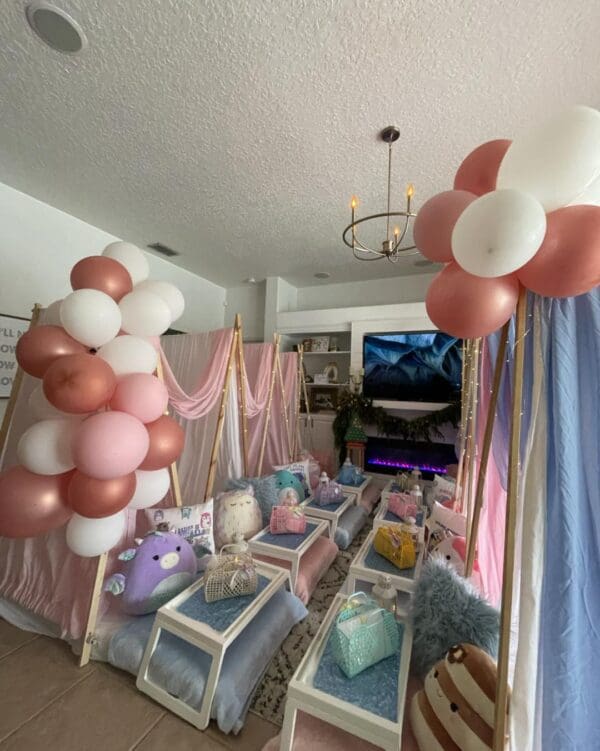 Experience the ultimate Camping Party Theme that transforms any room into a cozy, enchanting hideaway. Imagine rustic mini tables, inviting pillows, and adorable plush toys setting the perfect scene for your indoor adventure. Lively clusters of pink and white balloons add a delightful touch of whimsy, crafting an ideal atmosphere for an unforgettable sleepover experience. Perfectly designed to capture imaginations, this setup creates lasting memories in a charming and playful setting. Ideal for children’s parties or themed gatherings, this whimsical decor captures the essence of fun and relaxation all in one magical location.