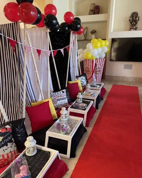 Immerse yourself in the ultimate Movie Night Extravaganza, where your room is transformed into a captivating cinematic oasis. Delight in popcorn-themed decorations that evoke nostalgia, while a luxurious red carpet adds an element of Hollywood glamour. Vibrant balloons float overhead, creating a festive atmosphere alongside an array of plush, cozy pillows inviting you to relax in style. The expertly arranged lounge seating along the red carpet ensures each guest enjoys an unforgettable viewing experience wrapped in comfort and enchantment. Ideal for film enthusiasts seeking a unique movie night at home!