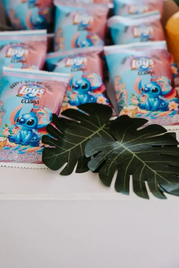 A display of Lays snack bags featuring the character from the movie "Lilo & Stitch" next to two decorative green leaves, within our Event Photography Packages.